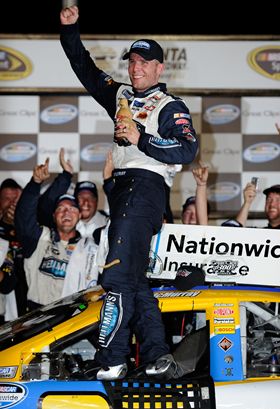 In Victory Lane, Jamie McMurray celebrates his first NASCAR Nationwide Series win of the season and his eighth in the series overall. Credit: John Harrelson/Getty Images for NASCAR